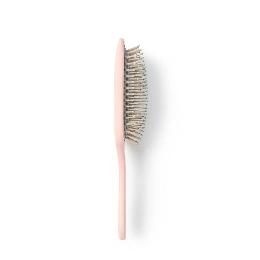 TYMO pink paddle brush – side angle view