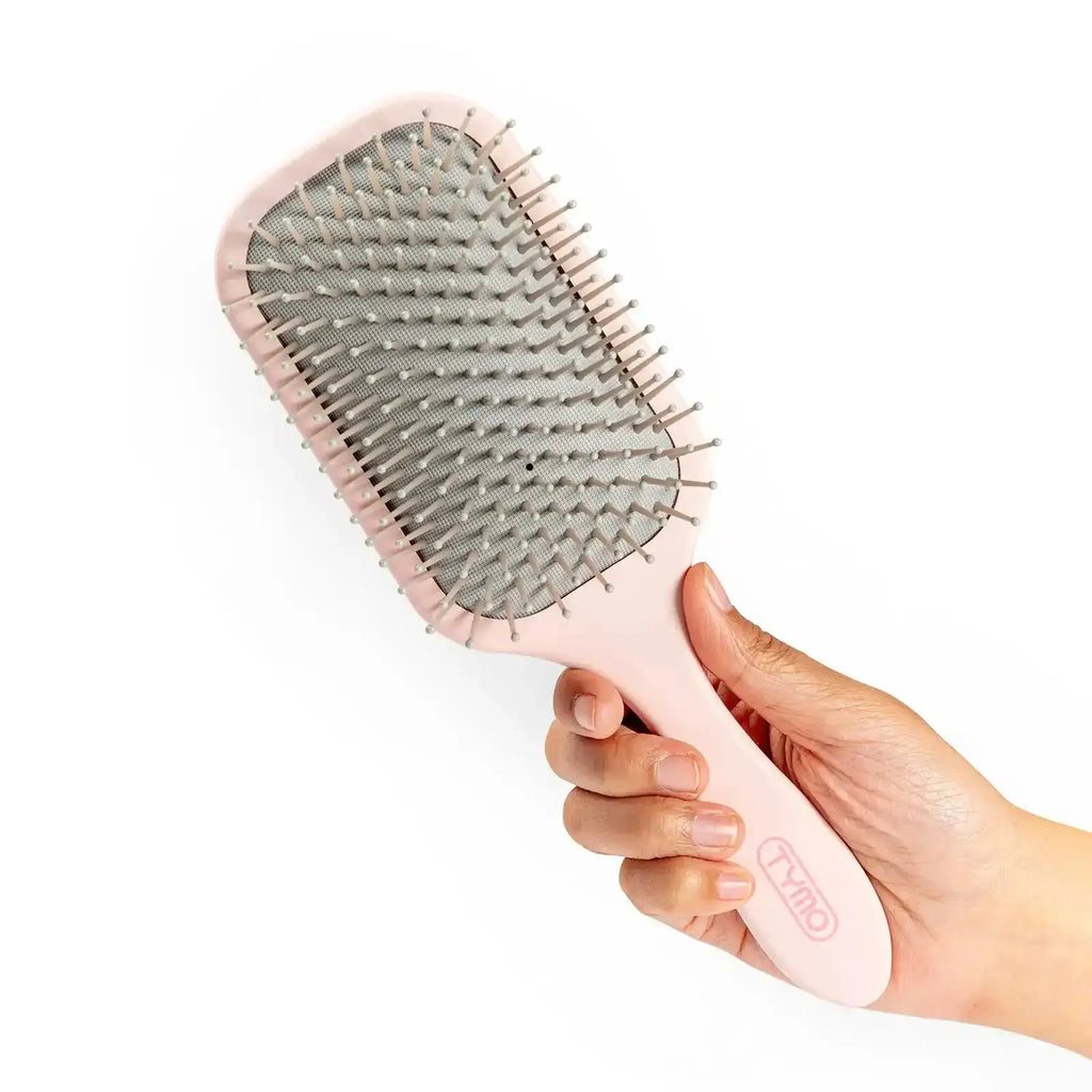 TYMO pink paddle brush – in-use styling result